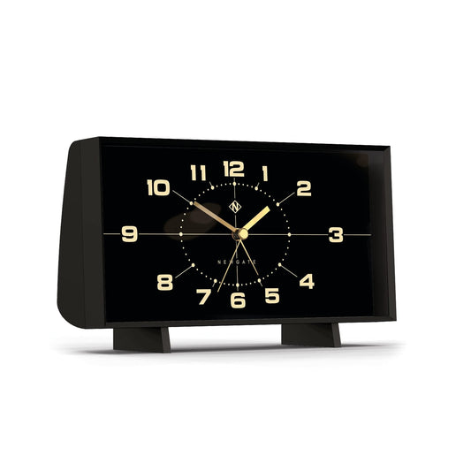 Newgate alarm clock, black case with feet, gold dial and reverse-style hands, angled view
