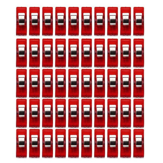Set of sewing craft binding clips with red translucent bodies and clear jaws