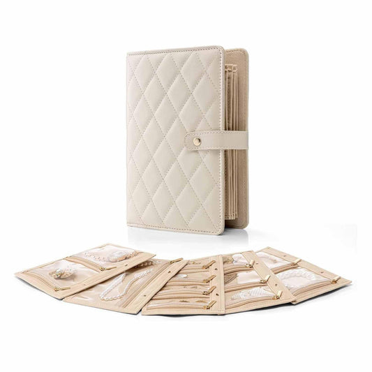 Quilted white jewelry organizer binder with snap strap and ring binding, portable cover