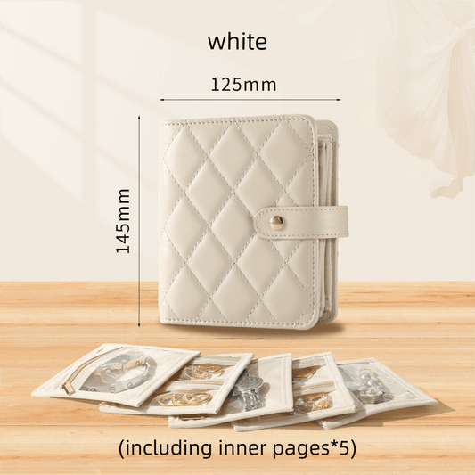 White quilted jewelry storage book with clasp and five inner velvet pouches