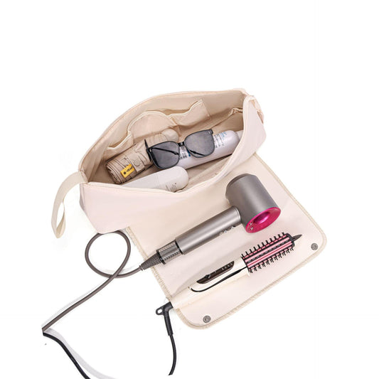 Cream roll-up travel case with snap flap holding hair tools and cords