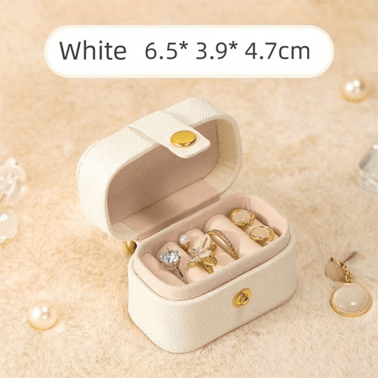 White mini jewelry travel case with open lid, ring and earring compartments