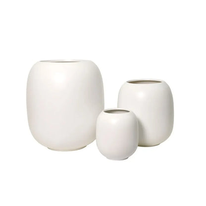 White ceramic vase set of three with rounded bodies and open tops