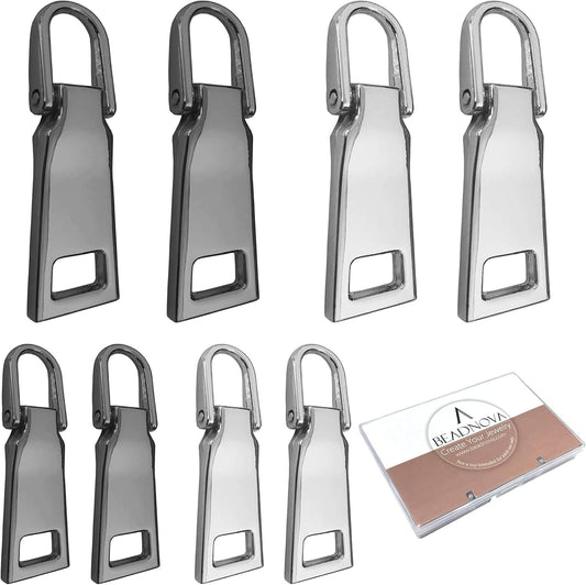 Metal zipper pull tabs, black and silver finishes, with small rectangular latch openings