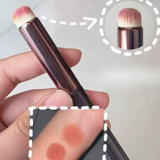 Lip brush with round head; close-up of pink bristles on rose-gold handle.