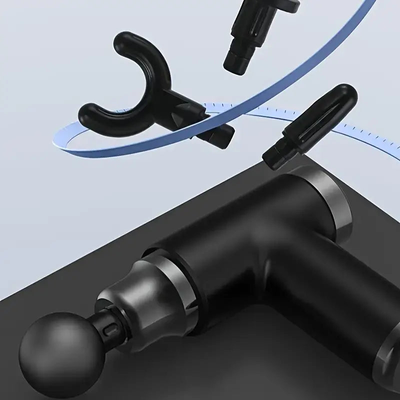 Black mini massage gun with interchangeable nozzle head and angled grip handle