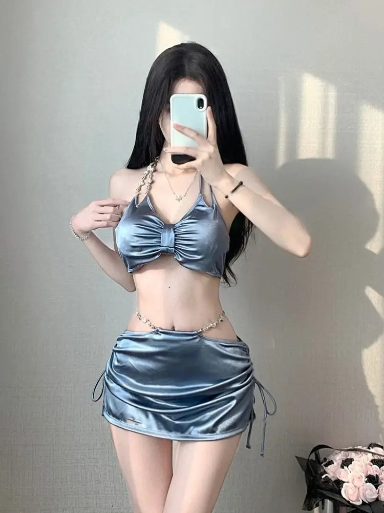 Women’s silver satin bikini set with ruched front triangle top and drawstring mini skirt