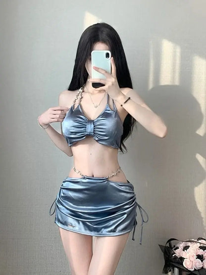 Women’s silver satin bikini set with ruched front triangle top and drawstring mini skirt