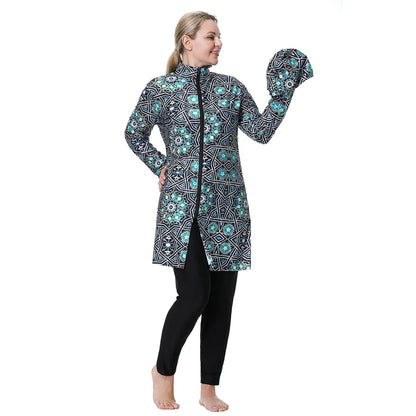 Back view: blue geometric print hooded swim tunic with long sleeves and black leggings.