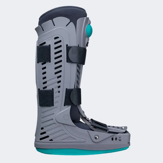 Snowboard boot with gray shell, black straps, teal rocker sole