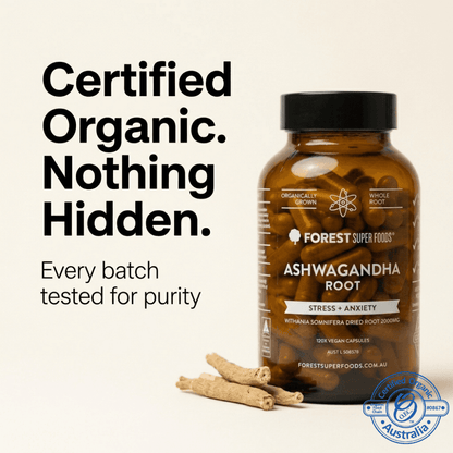 Ashwagandha root supplement bottle with dried roots and capsules beside it