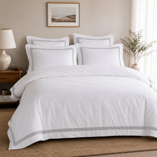 Queen quilt cover set in white with light grey trim and matching pillow shams