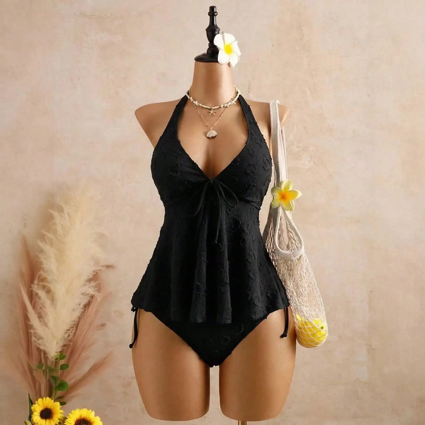 Black textured halter peplum bikini set with tie-front top and high-cut bottoms