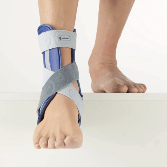 Ankle splint brace with grey wrap and blue support, worn on foot and lower leg