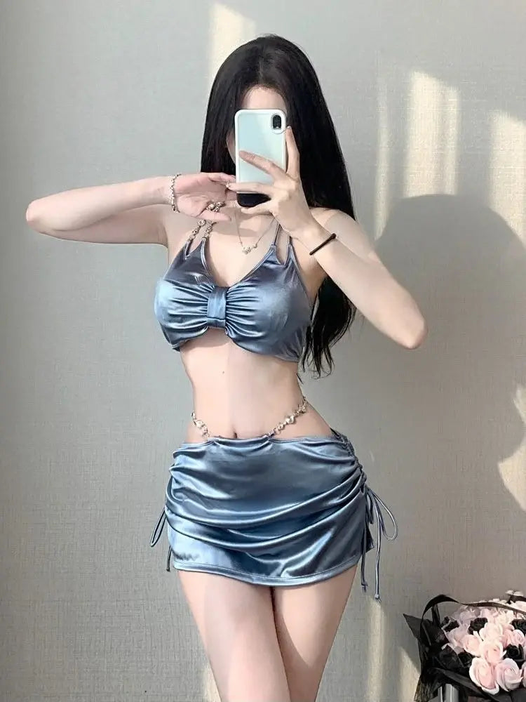 Women’s silver satin bikini set with ruched triangle bra top and matching mini skirt