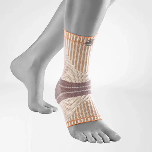Beige knit ankle support sock with mauve heel band and orange trim, compression fit