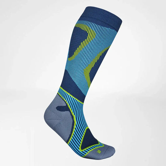 Full-length performance socks in dark blue with neon yellow graphic stripes.
