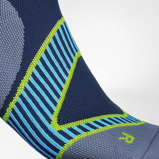 Navy low-cut performance socks with blue stripe pattern and neon green trim