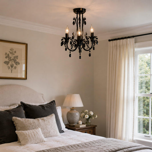 Black 3-light leaf chandelier with swirling metal arms and teardrop accents