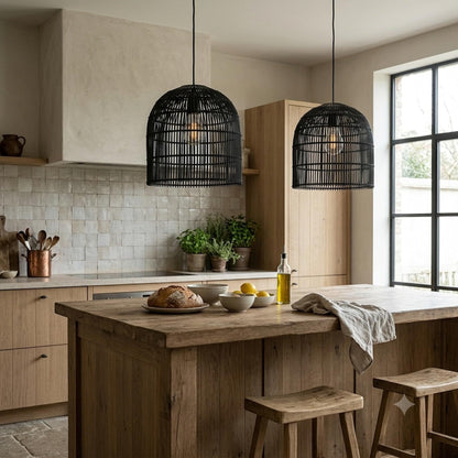 Pair of black cage rattan cane pendant lights hanging from cords