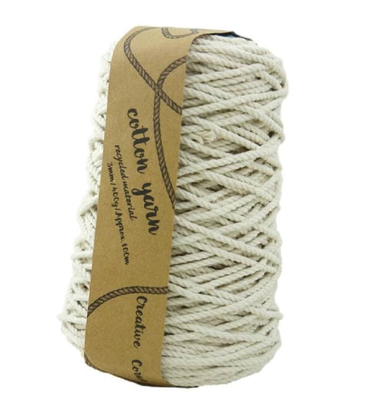 Natural macrame cotton yarn skein, tightly wound with 3mm thick strands.