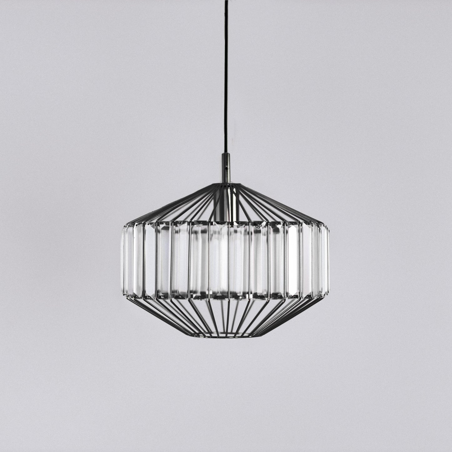 Black prism glass pendant light centered, faceted clear glass panels in black frame