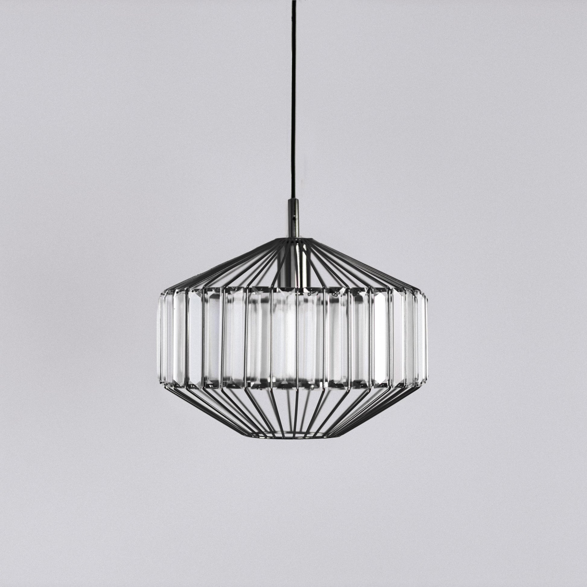 Black prism glass pendant light centered, faceted clear glass panels in black frame