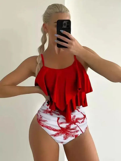 Two-piece swimsuit with red ruffle halter top and white palm-print high-waist bottoms