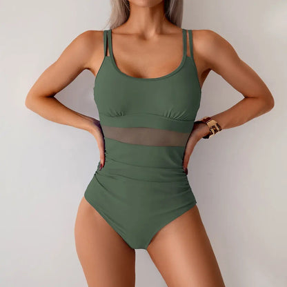 Women’s one-piece swimsuit in dark green with ruched waist, high-cut legs, sheer side panels
