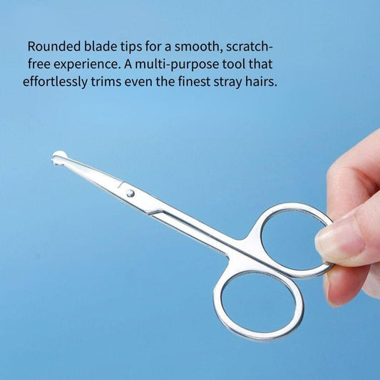 Stainless steel nose hair scissors with rounded blade tips in hand