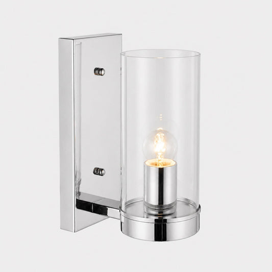 Chrome wall pendant light with clear glass cylinder shade and visible filament bulb.