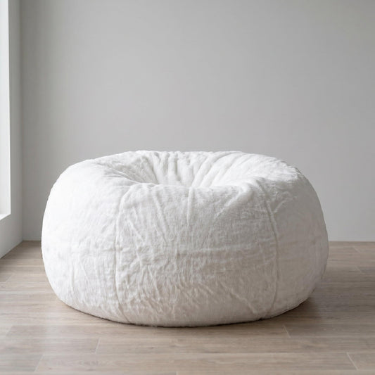 White plush fur cloud-shaped bean bag with rounded base and tufted seams