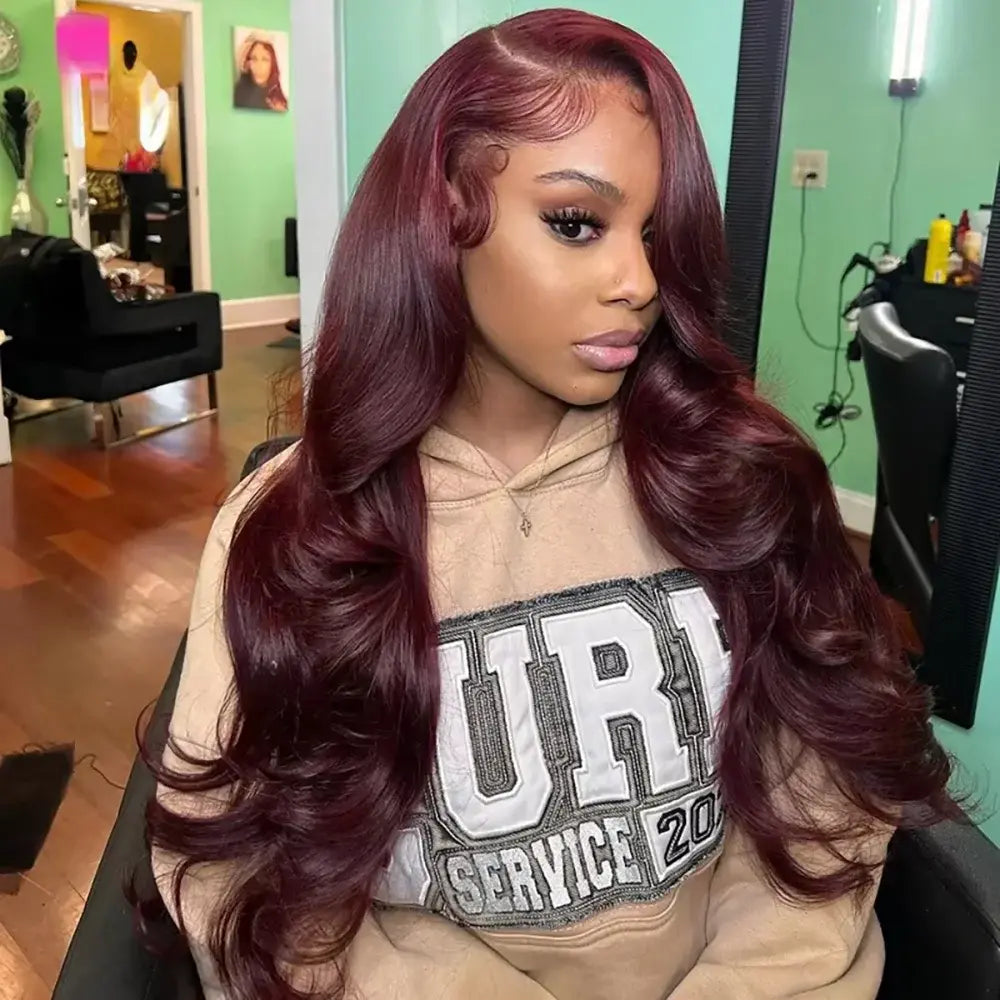Burgundy red lace front wig with voluminous body wave curls and defined hairline