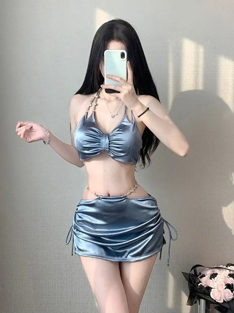 Women’s silver satin bikini set with ruched triangle top and drawstring mini skirt