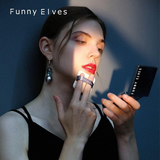 Foundation powder compact applied to skin, woman holding the makeup powder