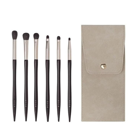 Eye makeup brush set with 7 brushes; dark bristles, black handles, and beige storage pouch