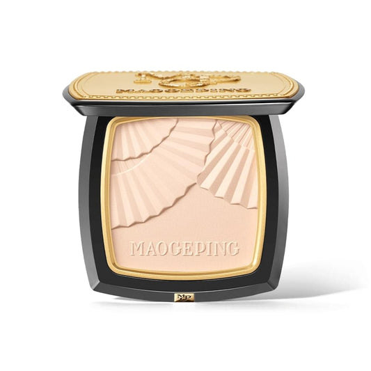 Luminous pressed powder compact with ribbed beige pan and gold-toned lid
