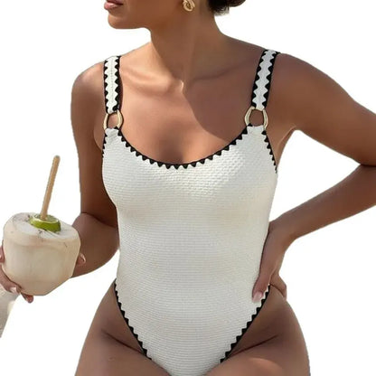 Women’s white one-piece swimsuit with black trim, sleeveless V-neck, high cut