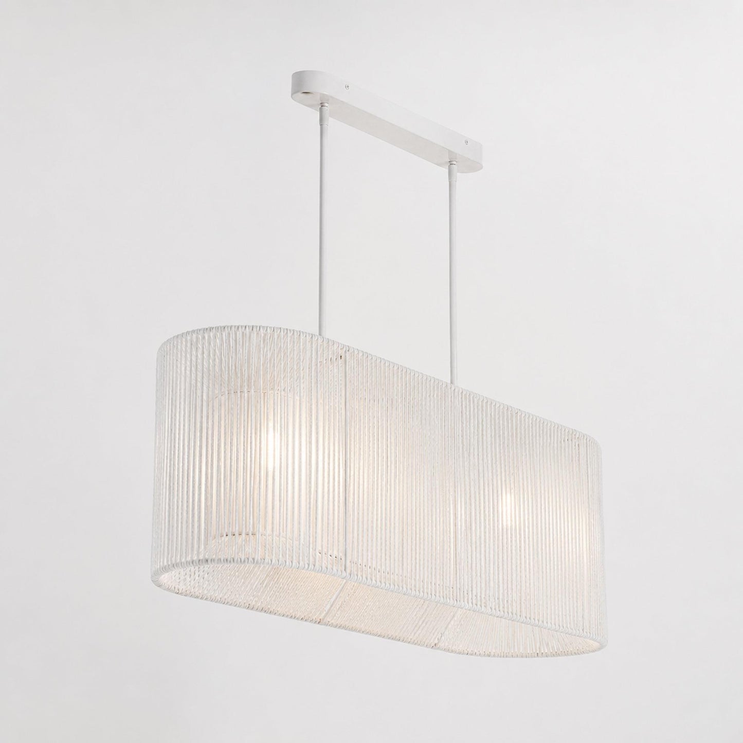 White rope pendant light with drum-shaped fabric shade and hanging rod