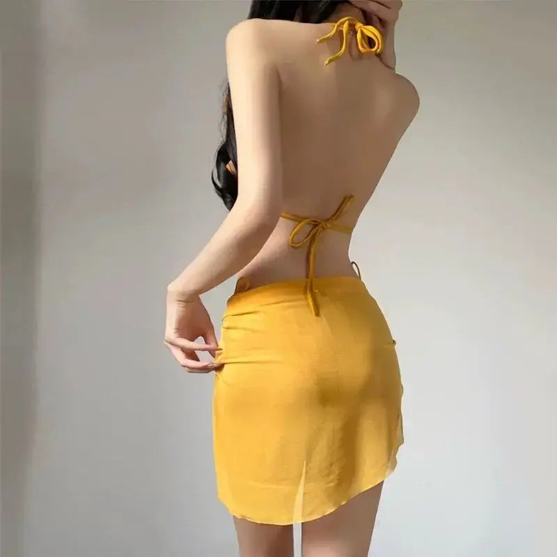 Yellow 3-piece bikini set with halter triangle top, tie-back bottom, and wrap cover