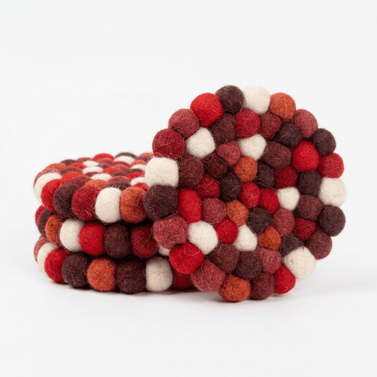 Wool felt coaster set of 4, round pieces in red and brown with white pom details