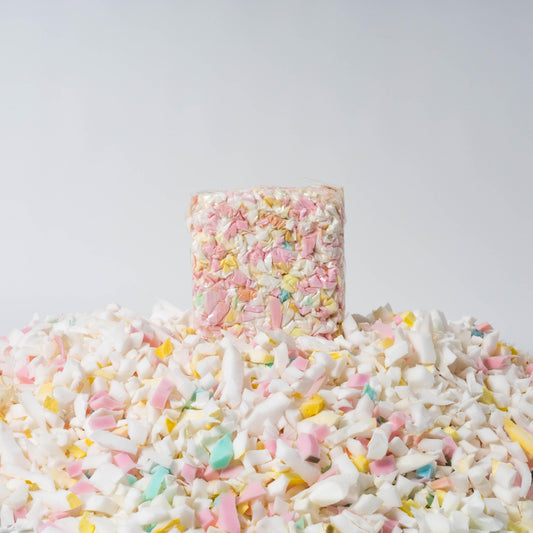 Bag of pastel shredded foam bean bag filling, multicolor cubes and shreds