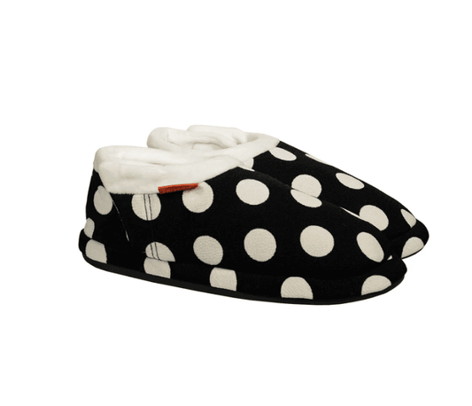 Closed-toe orthotic slippers in black with white polka dots, plush white lining.