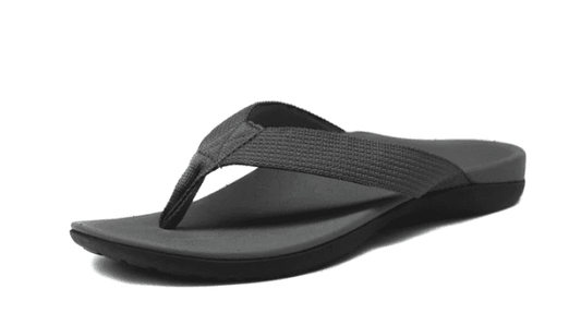 Grey women’s flip flops with cross strap and thick textured rubber sole, side view