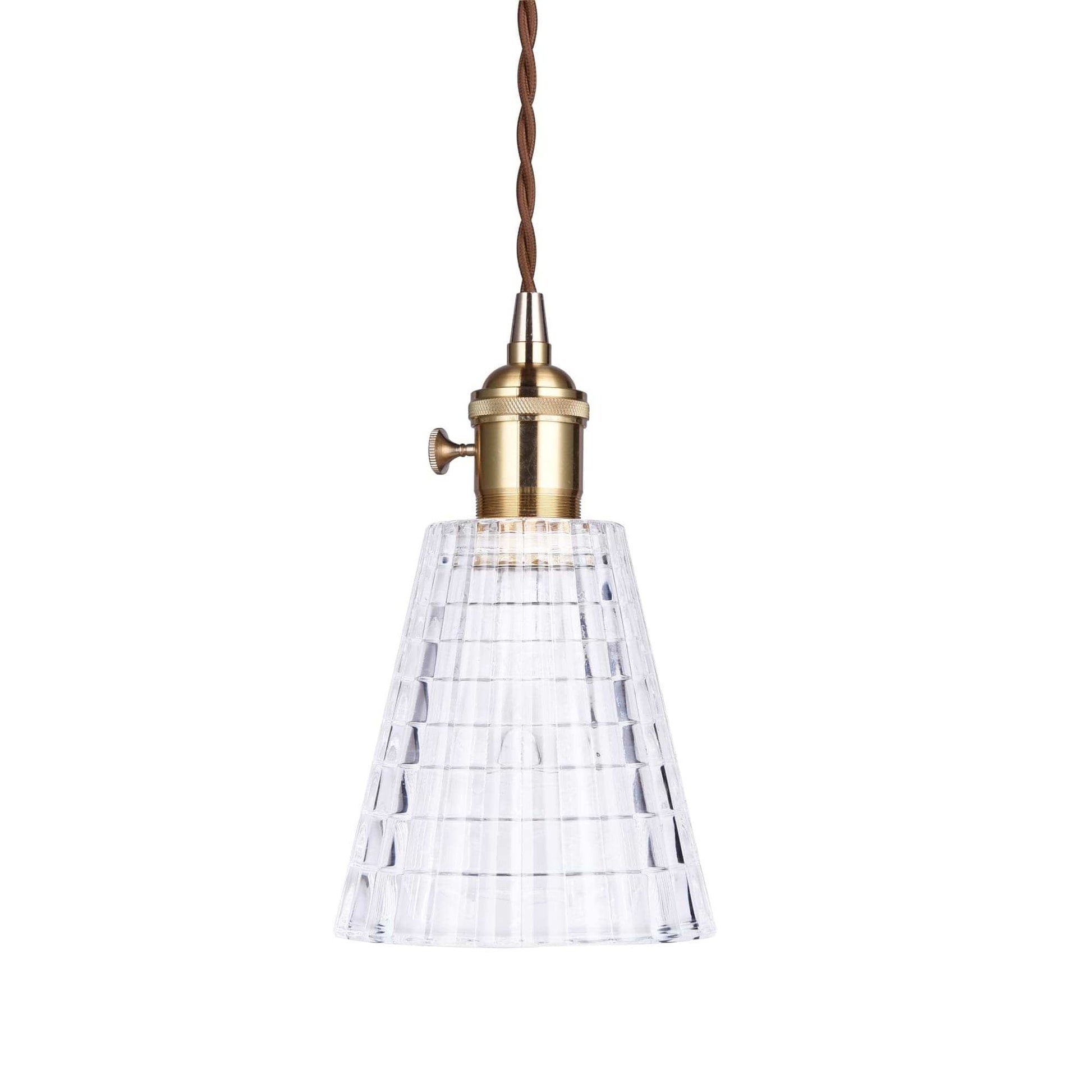 Single clear ribbed glass pendant light with antique brass socket and braided cord.