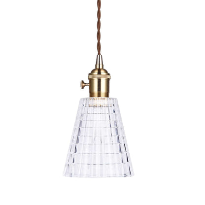 Single clear ribbed glass pendant light with antique brass socket and braided cord.