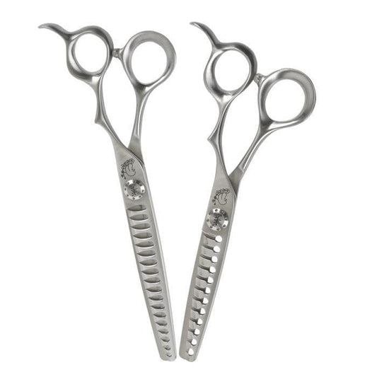 Straight hair cutting scissors, silver metal with two finger holes and notched blade edge