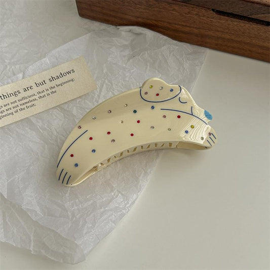 White puppy hair claw clip with colorful rhinestones, claw-style hair grip.
