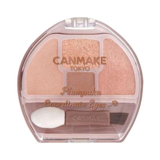 Plastic compact eye shadow palette with clear cover, blush shades, and applicator