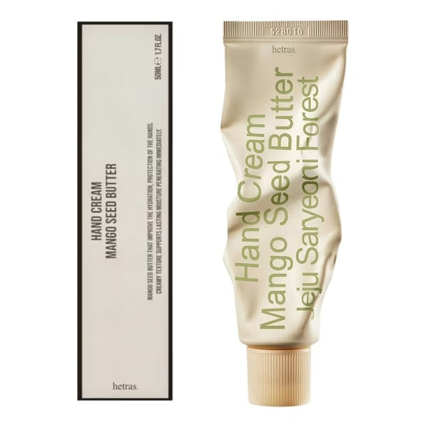 Hetras mango seed hand cream tube with beige-gold finish, printed Hand Cream and notes